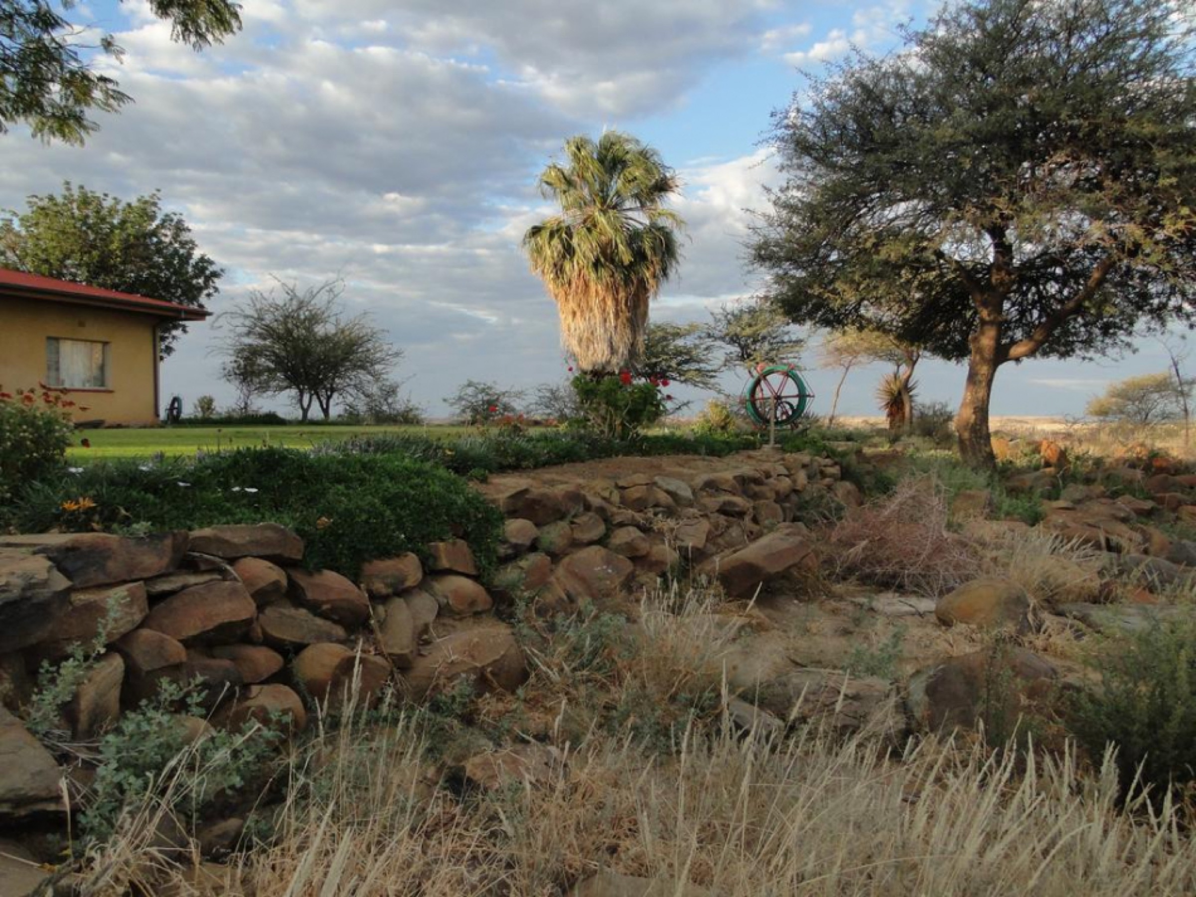Farm garden, stone terraces and open countryside at Gamis