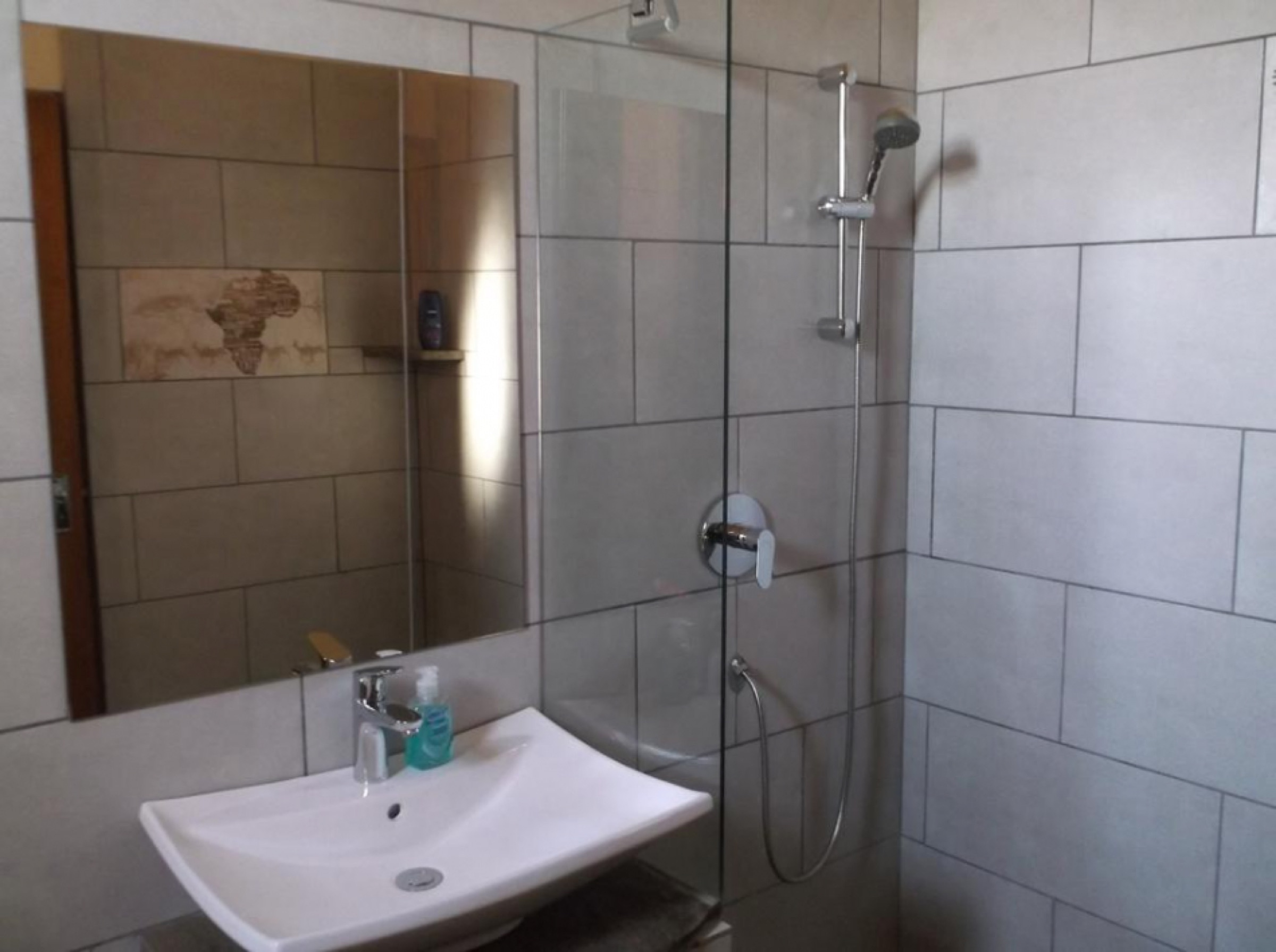 Bathroom with shower and basin