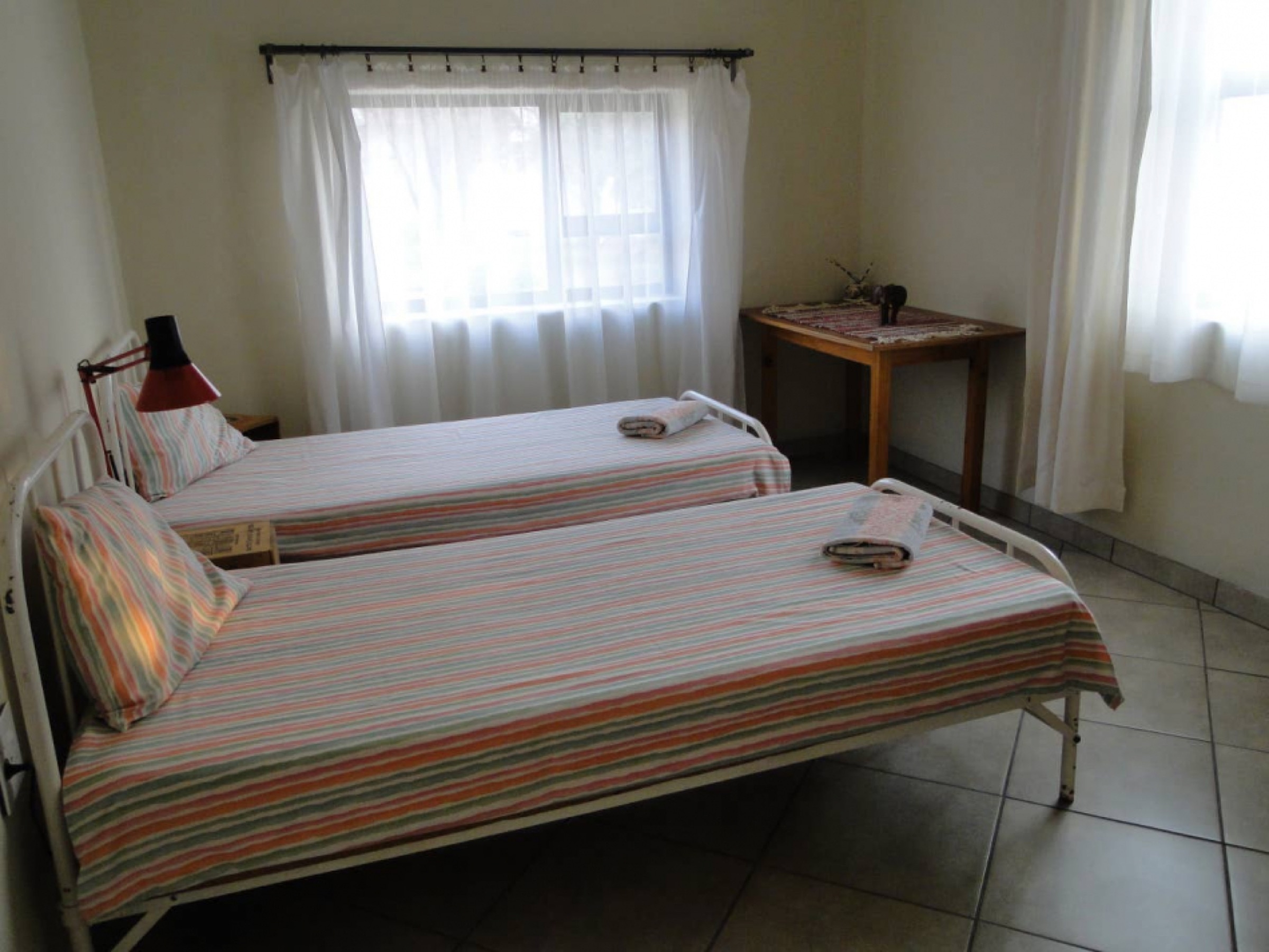 Bright bedroom with two single beds