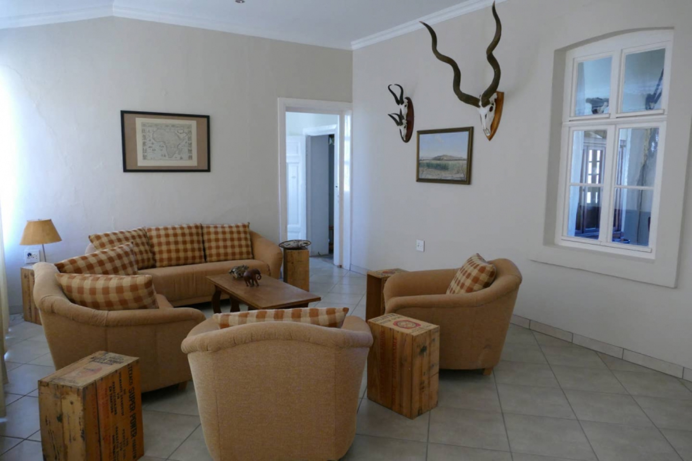 Lounge with sofas and antelope horns on the wall
